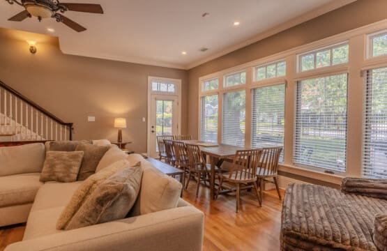 A casual gathering table invites shared laughter, lively conversation, games, snacks, coffee or tea, planning, laptop time, and easy connection throughout the stay.