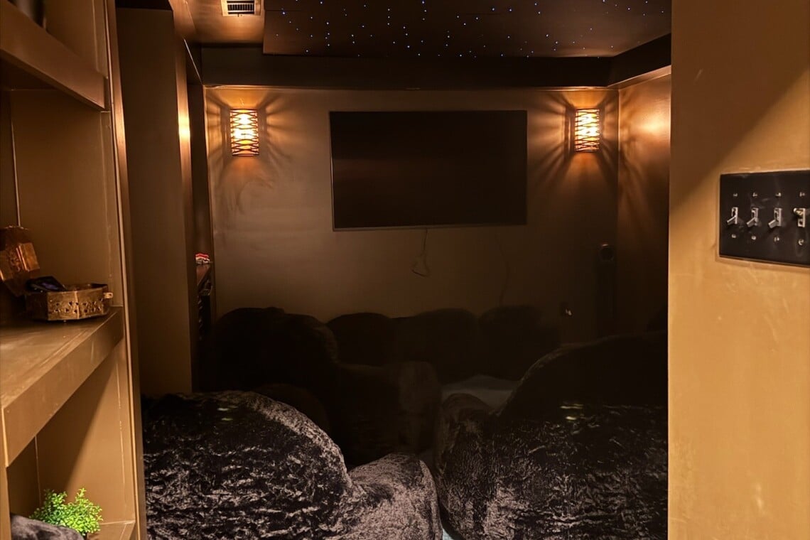 A comfy, cozy theater space invites guests to watch, play, unwind, and enjoy a quieter, more intimate viewing experience.