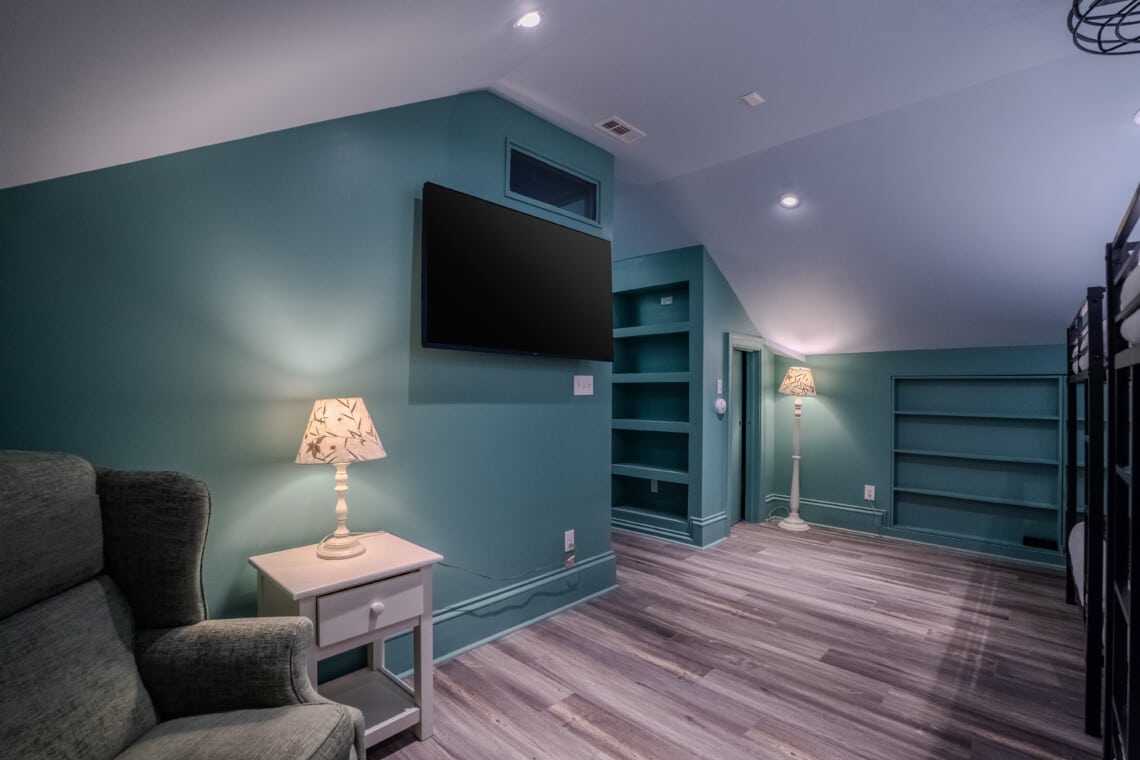 The Oaks Bedroom #5 with Four (4) Queen Bunk Beds, Built-In Desk Area, Ceiling Fan and En Suite Bathroom with Tub and Shower