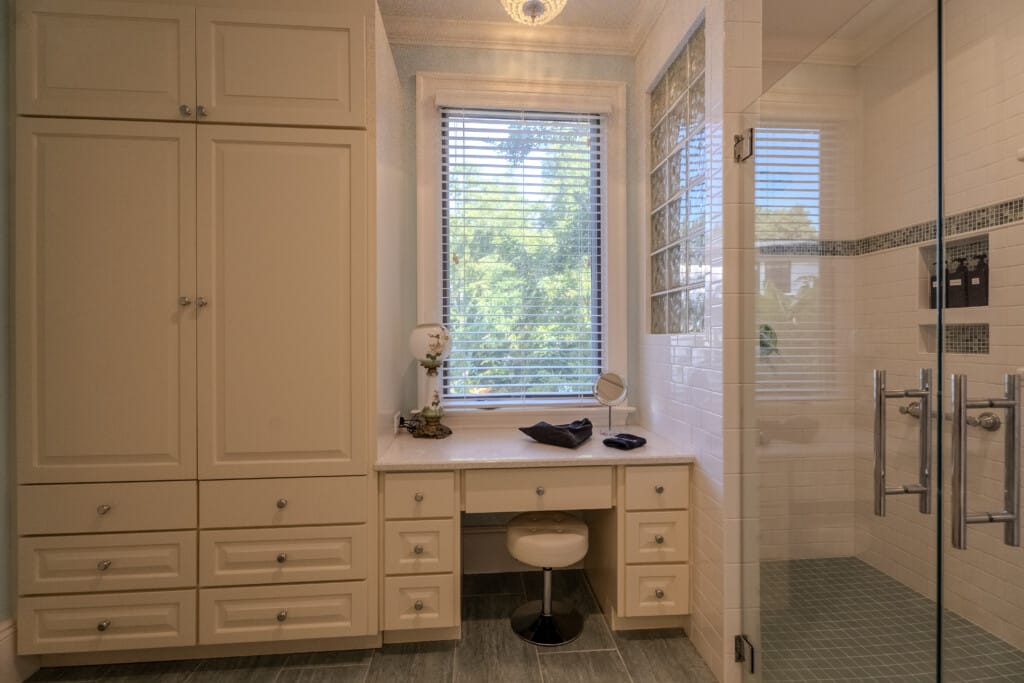 Natural light streams in to highlight bathroom details that add ease, comfort, and convenience for guest stays and multi-generational visits.