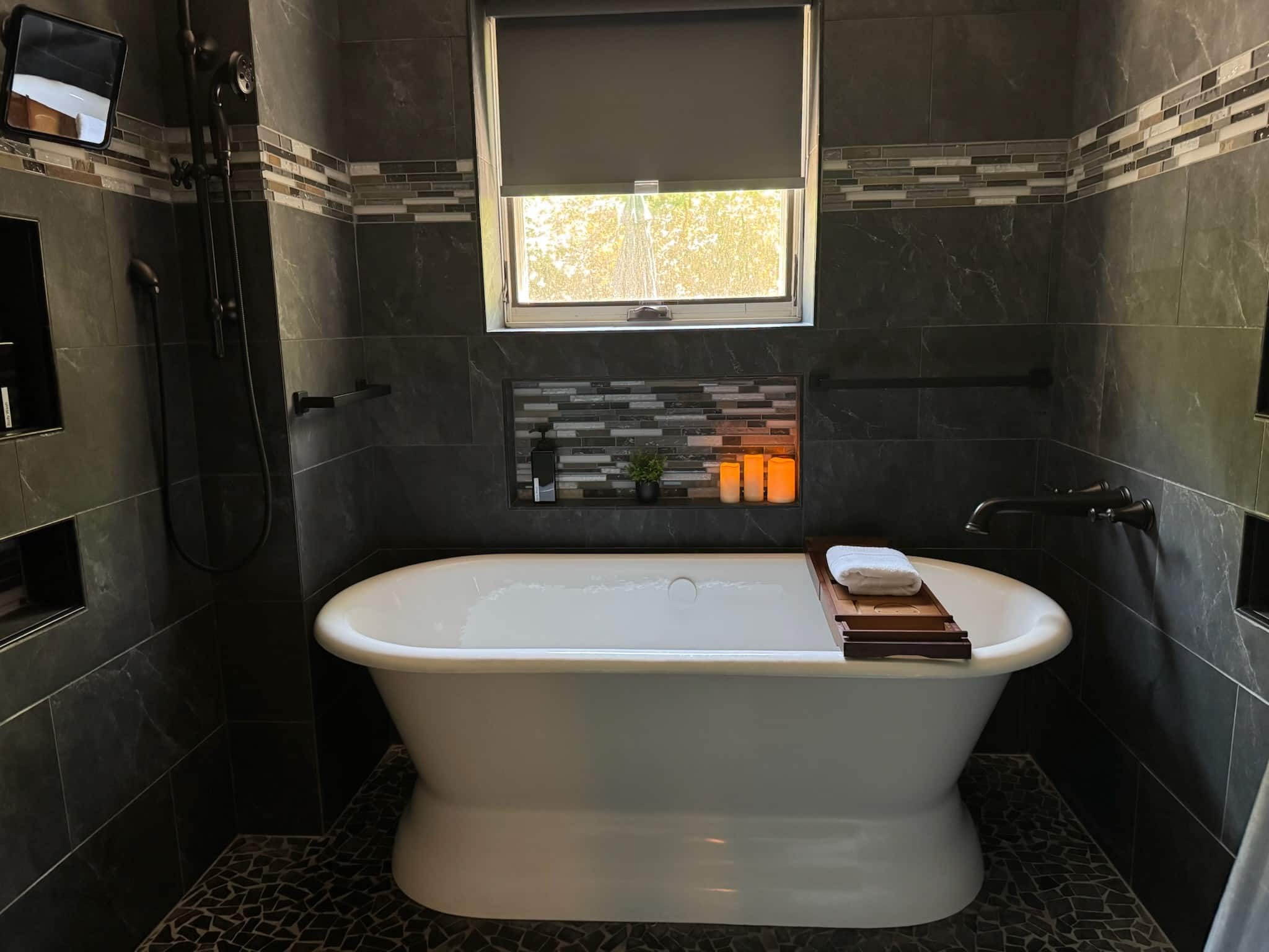 A soaking tub invites guests to unwind after travel, events, meetings, or a full day exploring Raleigh.