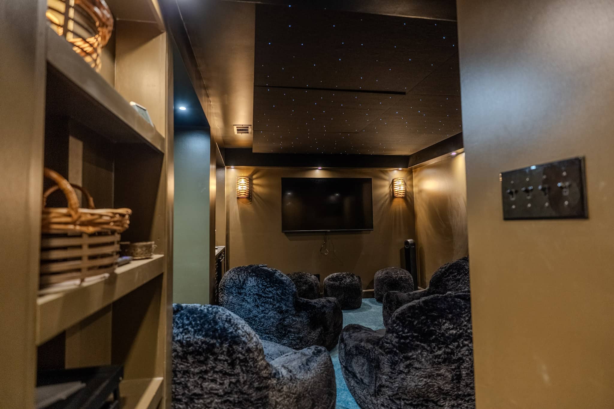 An additional intimate media room offers another cozy place to watch, play, present, and unwind.
