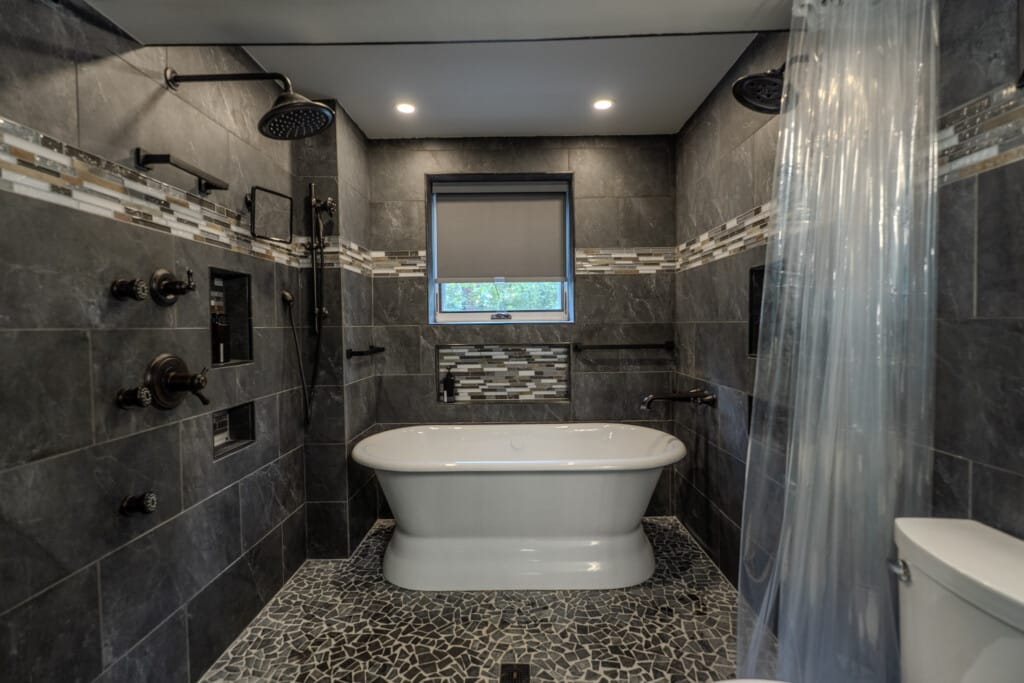 A zero-entry shower option adds comfort and ease for guests who appreciate thoughtful bathroom design.