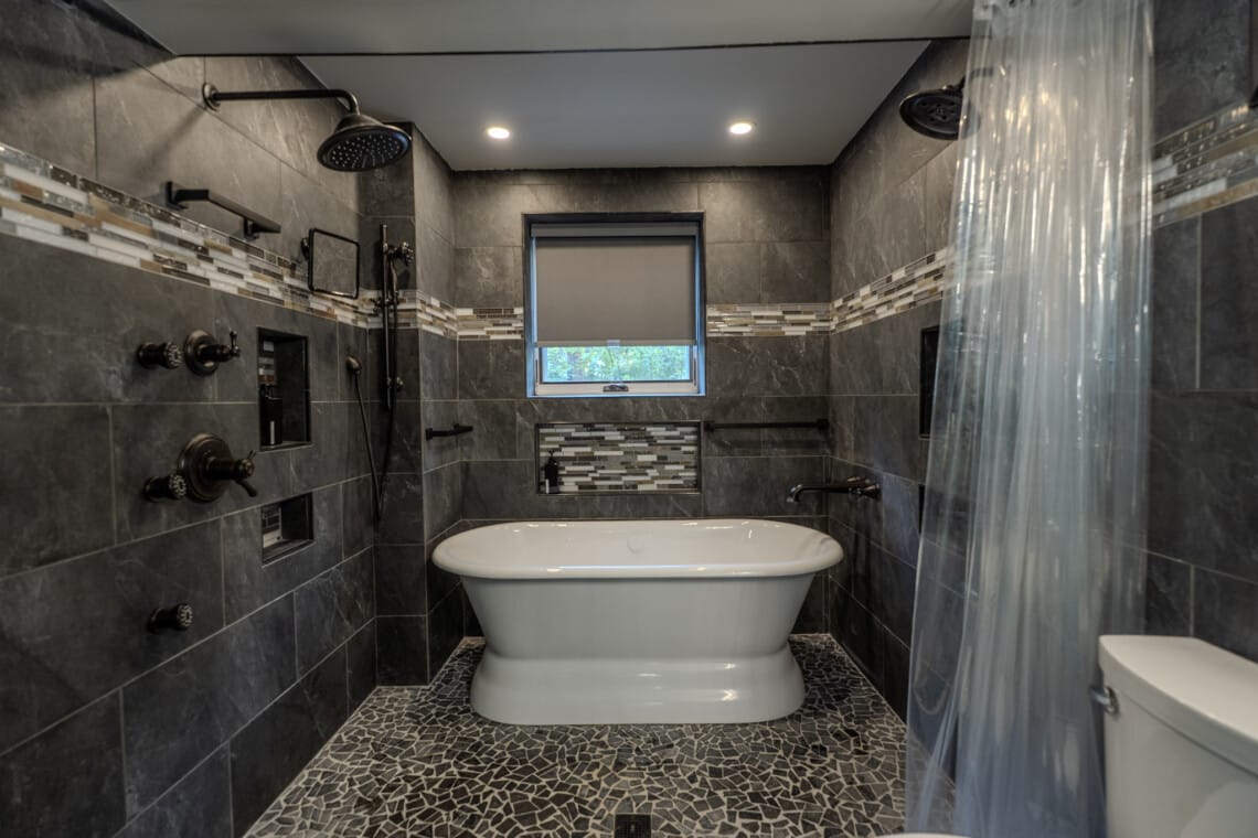 A zero-entry shower option adds comfort and ease for guests who appreciate thoughtful bathroom design.