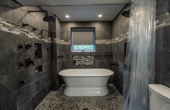 A zero-entry shower option adds comfort and ease for guests who appreciate thoughtful bathroom design.