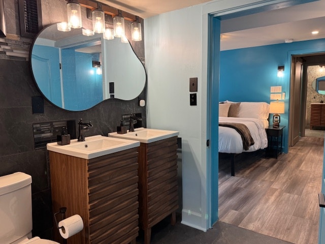 Dual vanities, carefully placed niches, and a natural flow to the bedroom add convenience, privacy, and a sense of retreat.